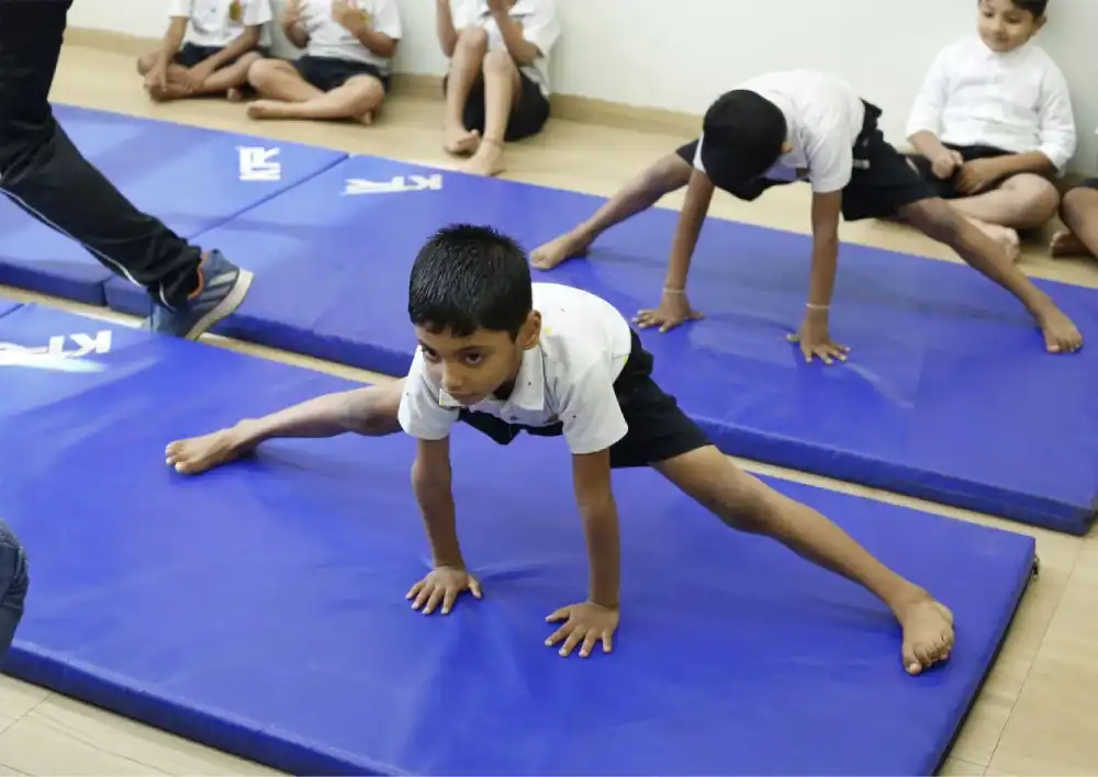 isgs kids performing yoga